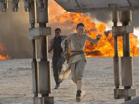 This photo provided by Disney/Lucasfilm shows Daisy Ridley, right, as Rey, and John Boyega as Finn, in a scene from the film, "Star Wars: The Force Awakens," directed by J.J. Abrams. (David James/Disney/Lucasfilm via AP)

AP PROVIDES ACCESS TO THIS HANDOUT PHOTO TO BE USED SOLELY TO ILLUSTRATE NEWS REPORTING OR COMMENTARY ON THE FACTS OR EVENTS DEPICTED IN THIS IMAGE. THIS IMAGE MAY ONLY BE USED FOR 14 DAYS FROM TIME OF TRANSMISSION; NO ARCHIVING; NO LICENSING.