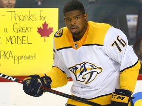 A young fan shares a sign with Predators P.K. Subban during warmup before NHL action on Dec. 16, 2017