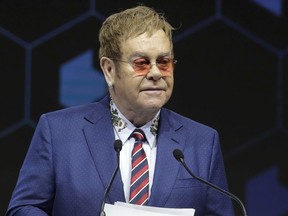 British musician Elton John delivers a speech during the ceremony for the Crystal Awards on the eve of annual meeting of the World Economic Forum in Davos, Switzerland, Monday, Jan. 22, 2018. The award celebrates the achievements of leading artists who are bridge-builders and role models for all leaders of society.