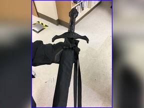 This photo provided by the Kirkland Police Department shows an umbrella with a sword-shaped handle on Wednesday, Jan. 17, 2018 in Kirkland, Wash. (Kirkland Police Department via AP)