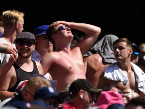 A sunburnt English fan looks to the sun while watching the cricket on the fourth day of the fifth Ashes cricket Test match between Australia and England at the SCG in Sydney on January 7, 2018. (WILLIAM WEST/AFP/Getty Images)