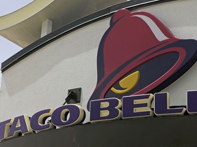 This Thursday, Aug. 3, 2017, photo shows a Taco Bell sign at a restaurant in Hialeah, Fla.  (AP Photo/Alan Diaz, File)