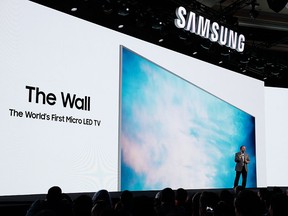 Samsung's Joseph Stinziano introduces the 146-inch modular TV called The Wall during a news conference at CES International, Monday, Jan. 8, 2018, in Las Vegas. (AP Photo/Jae C. Hong)