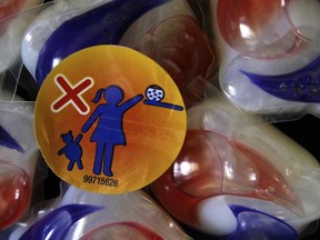 In this May 24, 2012, file photo, a warning label is attached to a package of Tide laundry detergent packets in Houston.