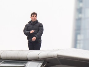 Tom Cruise films Mission Impossible in front of some of London's skyline on Sunday, Jan. 14, 2018.