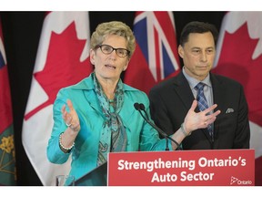 Ontario Premier Kathleen Wynne and Minister Brad Duguid hold a press conference after meeting with key auto industry leaders in Toronto, Ont. on Friday March 24, 2017. Stan Behal/Toronto Sun/Postmedia Network
