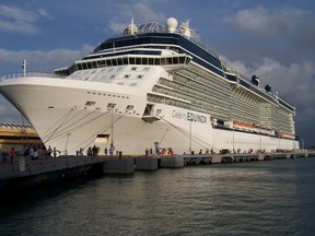 This June 13, 2017 photo shows Celebrity Cruises' Equinox at dock in San Juan, Puerto Rico. The ship carries 2,850 passengers, features a real grass lawn, Sky Observation Lounge and specialty restaurants like Tuscan Grille and Silk Harvest. (Joe Kafka via AP) ORG XMIT: NYLS209
