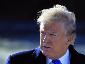 President Donald Trump walks on the South Lawn as he leaves the White House in Washington, Friday, Jan. 5, 2018, enroute to Camp David, Md., to participate in congressional Republican leadership retreat.