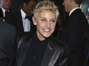 FILE - In this March 2, 2014 file photo, Ellen DeGeneres appears backstage during the Oscars in Los Angeles. DeGeneres made history 20 years ago as the first prime-time lead on network TV to come out, capturing the hearts of supporters gay and straight amid a swirl of hate mail, death threats and, ultimately, dark times on and off the screen.