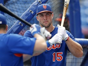 In this March 13, 2017, file photo, New York Mets' Tim Tebow takes batting practice before a spring training baseball game against the Miami Marlins, in Port St. Lucie, Fla.