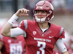 In this Sept. 17, 2016 file photo, Washington State quarterback Tyler Hilinski runs onto the field with his teammates before an NCAA college football game against Idaho in Pullman, Wash