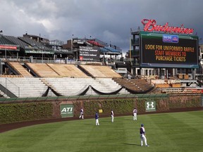 In this May 11, 2015, file photo, construction continues on the right field bleachers at Wrigley Field before a baseball game between the Chicago Cubs and New York Mets in Chicago. (AP Photo/Charles Rex Arbogast, File)