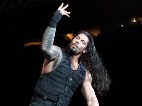 Roman Reigns celebrates winning the main event in World Wrestling Entertainment which had 5,000 people in attendance at Saddledome on Sunday Calgary on February 1, 2015. (Lorraine Hjalte/Calgary Herald)