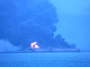 In this photo provided by Korea Coast Guard, the Panama-registered tanker "Sanchi" is seen ablaze after a collision with a Hong Kong-registered freighter off China's eastern coast Sunday, Jan. 7, 2018. The oil tanker collided with a bulk freighter and caught fire off China's eastern coast, leaving its entire crew of 32 missing, most of them Iranians, authorities said. (Korea Coast Guard via AP)