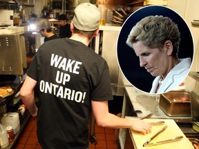 Nick Thompson, cook at the Black Tomato restaurant in Ottawa, works in the kitchen wearing a "wake up Ontario" slogan before the restaurant closes its doors due to a minimum wage increase.