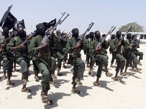 In this Thursday, Feb. 17, 2011 file photo, hundreds of newly trained al-Shabab fighters perform military exercises in the Lafofe area some 18 km south of Mogadishu, in Somalia.