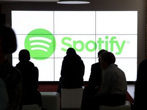 People wait for the start of an event by Spotify, the world leader in music streaming, in Berlin on May 20, 2015.