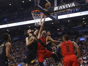 Toronto Raptors' Jonas Valanciunas shuts down Portland Trail Blazers' Jusuf Nurkic during Friday's game. (JACK BOLAND/Toronto Sun)