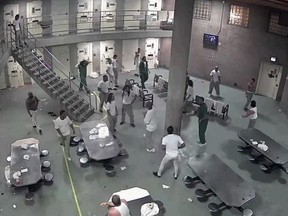 In this screenshot, inmates at Cook County Jail fight on Feb. 16, 2018.