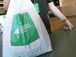Josh Girman, Product Team Leader at Mountain Equipment Co-op, displays a biodegradable bag similar to a plastic bag, in the downtown Winnipeg location Wednesday, March 5, 2008.