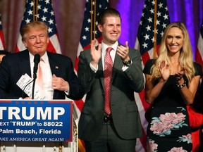 Republican presidential candidate Donald Trump (L) with his son Donald Trump Jr (C) and daughter - in - law Vanessa Trump (R) addresses the media following victory in the Florida state primary on March 15, 2016 in West Palm Beach, Florida.