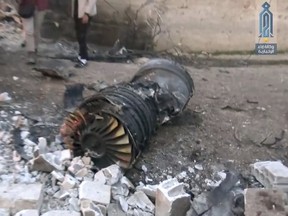 This photo provided by the Ibaa News Agency the media arm of al-Qaida’s branch in Syria shows part of a Russian plane that was shot down by rebel fighters over northwest Idlib province in Syria, Saturday, Feb. 3, 2018. (Ibaa News Agency via AP)