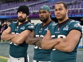 (L-R) Joe Walker #59, Nigel Bradham #53 and Jordan Hicks #58 of the Philadelphia Eagles pose for a photo during Super Bowl LII practice on February 3, 2018 at US Bank Stadium in Minneapolis, Minnesota. The Philadelphia Eagles will face the New England Patriots in Super Bowl LII on February 4th.
