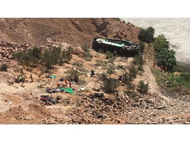 A bus is seen after run off the road and plunged into a ravine on the Panamerican road in southern Peru on February 21, 2018.