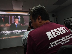 DACA recipients and their supporters watch US President Donald Trump during a State of the Union party at the Coalition for Humane Immigrant Rights and the California Dream Network offices in Los Angeles, California on January 30, 2018.