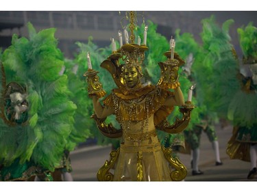 A reveller of the Imperatriz Leopoldinense samba school performs during the second night of Rio's Carnival at the Sambadrome in Rio de Janeiro, Brazil, on February 13, 2018. (MAURO PIMENTEL/AFP/Getty Images)