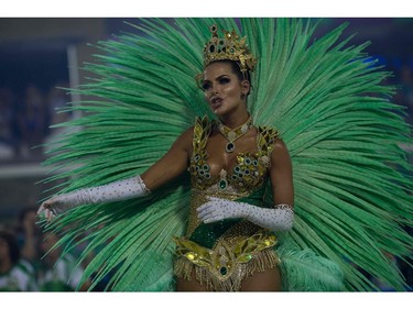 A reveller of the Imperatriz Leopoldinense samba school performs during the second night of Rio's Carnival at the Sambadrome in Rio de Janeiro, Brazil, on February 13, 2018.