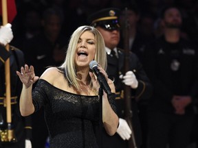 Singer Fergie performs the national anthem prior to an NBA All-Star basketball game, Sunday, Feb. 18, 2018, in Los Angeles. (AP Photo/Chris Pizzello)