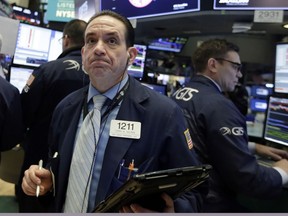 Trader Tommy Kalikas works on the floor of the New York Stock Exchange, Monday, Feb. 5, 2018. (AP Photo/Richard Drew)