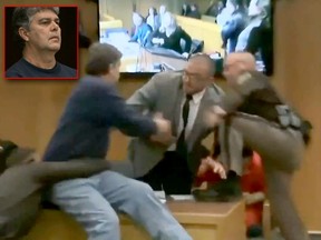 Video screengrabs show Randall Margraves attacks Larry Nassar during his sentencing hearing. (REUTERS Video Screenshots)