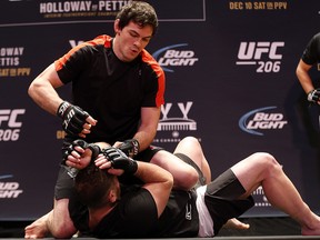 Canadian lightweight fighter Olivier Aubin-Mercier takes part in a workout with a coach in Toronto on Wednesday, December 7, 2016. (Jack Boland/Toronto Sun)