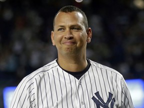 In this Aug. 12, 2016, file photo, New York Yankees' Alex Rodriguez smiles during a ceremony prior to his final baseball game with the team, against the Tampa Bay Rays in New York. New York said Sunday, Feb. 25, 2018, that Rodriguez is remaining with the New York Yankees as a special adviser.