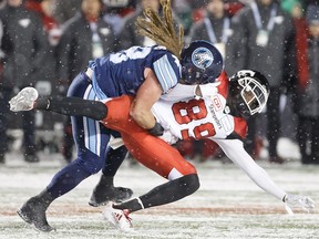 Bear Woods of the Toronto Argonauts tackles DaVaris Daniels of the Calgary Stampeders during the Grey Cup at TD Place Stadium on November 26, 2017 in Ottawa. (Andre Ringuette/Getty Images)
