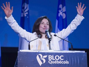 Newly acclaimed Bloc Quebecois leader Martine Ouellet salutes supporters during a rally Saturday, March 18, 2017 in Montreal.
