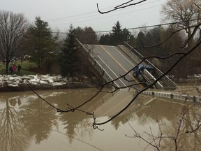 Collapsed bridge in the flood-hit Elgin County community of Port Bruce. (DEREK RUTTAN/Postmedia Network)