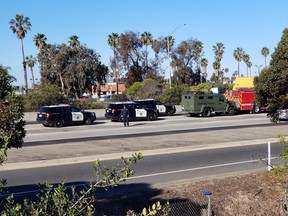 Ventura Police Department and Ventura Fire Department are parked along with California Highway Patrol on Interstate 101, Wednesday, Feb. 21, 2018, in Ventura, Calif. A rape suspect died after drinking cyanide during a freeway chase in Southern California on Wednesday, authorities said. Jonathan Hanks, 33, of Camarillo, was pulled from his car and pronounced dead at the scene on Interstate 101.  (Christian Martinez/The Ventura County Star via AP)