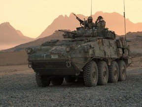 A Canadian light armoured vehicle arrives to escort a convoy at a forward operating base near Panjwaii, Afghanistan on Nov. 26, 2006.