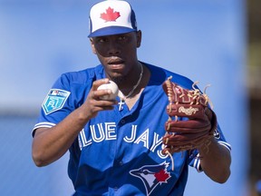 Blue Jays' Carlos Ramirez prepares to pitch at spring training in Dunedin, Fla. on Sunday, Feb. 18, 2018.