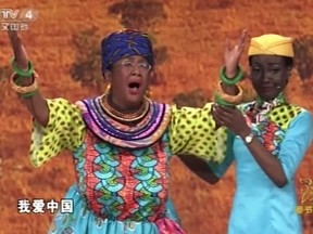 This is a screen grab take from CCTV China on Friday Feb. 16, 2018  showing dance sequence in an Africa skit shown on state television showing an Asian woman blacked up.  (CCTV via AP)