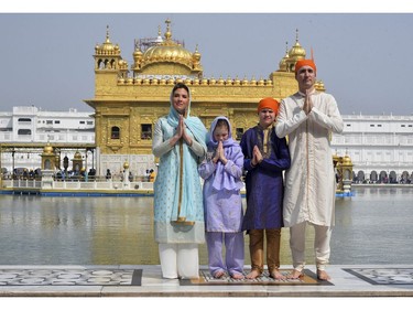 Canadian Prime Minister Justin Trudeau, right, his wife Sophie Gregoire Trudeau, left, their daughter Ella Grace, second left, and son Xavier greet in Indian style during their visit to Golden Temple, in Amritsar, India, Wednesday, Feb. 21, 2018.