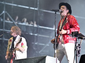 Richard Reed Parry and Win Butler of Arcade Fire perform on Day 4 at Lollapalooza in Grant Park in Chicago on August 6, 2017. Arcade Fire and Jessie Reyez are the leading nominees at this year's Juno Awards in Vancouver.Arcade Fire is in the running for best group, single, album and alternative album. THE CANADIAN PRESS/AP, Invision, Rob Grabowski