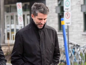 Former Parti Quebecois leader Andre Boisclair exits a police station in Quebec City, on Thursday, Nov. 9, 2017. Boisclair has been convicted of impaired driving, refusal to obey a police order and obstructing justice.THE CANADIAN PRESS/Vincent Fradet