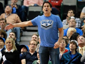 In this Dec. 14, 2015, file photo, Dallas Mavericks team owner Mark Cuban shouts in the direction of an official during an NBA basketball game against the Phoenix Suns, in Dallas