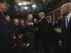 U.S. President Donald Trump greets Chairman of the Joint Chiefs of Staff Gen. Joseph Dunford after delivering his first State of the Union address in the House chamber of the U.S. Capitol to a joint session of Congress Tuesday, Jan. 30, 2018 in Washington.