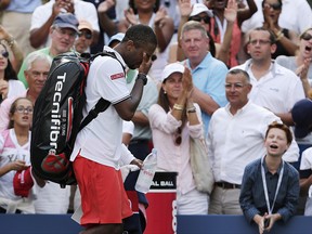 Donald Young reacts as he walks off the court after losing to Stan Wawrinka during the fourth round of the U.S. Open Monday, Sept. 7, 2015, in New York. (AP Photo/Charles Krupa)
