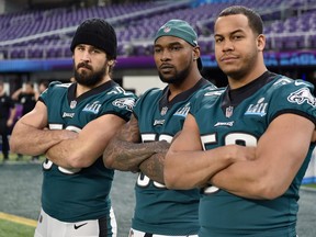 Left to right: Joe Walker #59, Nigel Bradham #53 and Jordan Hicks #58 of the Philadelphia Eagles pose for a photo during Super Bowl LII practice on February 3, 2018 at US Bank Stadium in Minneapolis, Minnesota. The Philadelphia Eagles will face the New England Patriots in Super Bowl LII on February 4th. (Hannah Foslien/Getty Images)